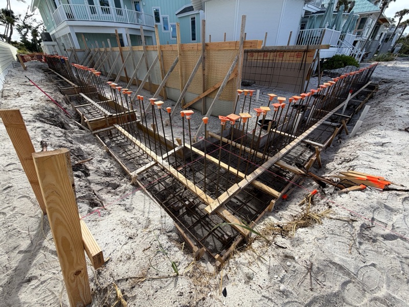 Footing and grade-beam forms with rebar set on a beachfront lot