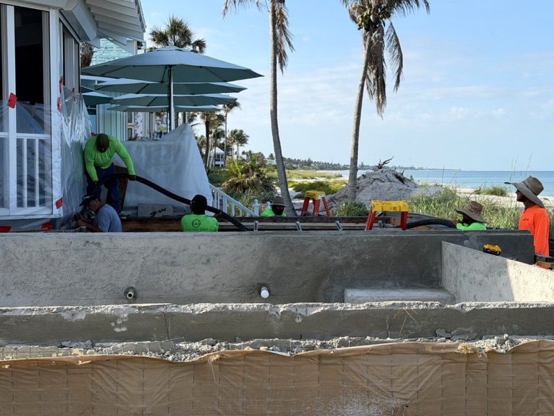Concrete pool shell taking shape steps from the beach
